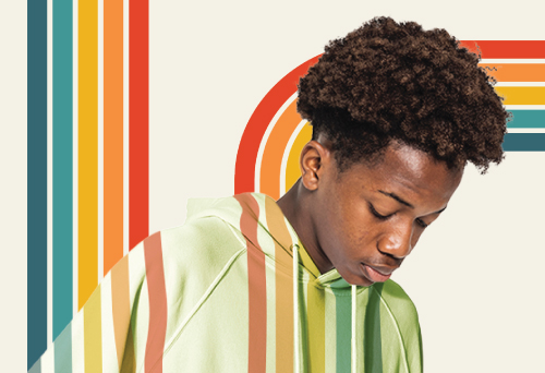 Young black boy with retro rainbow graphic